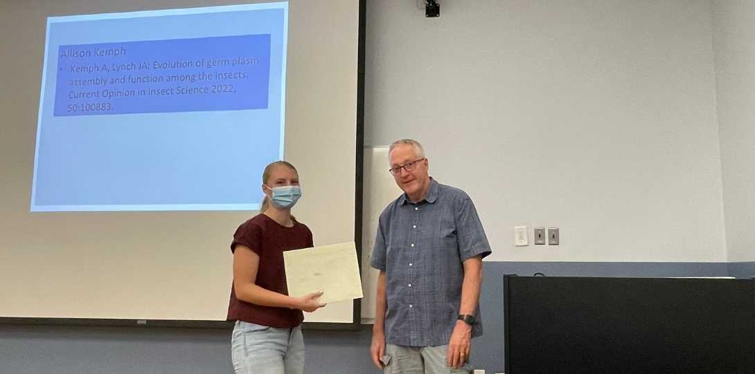 A grad student receives her award